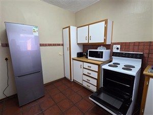 Kitchen with stove - Duplex For Sale in Belgravia Kimberley Northern Cape - P1616373